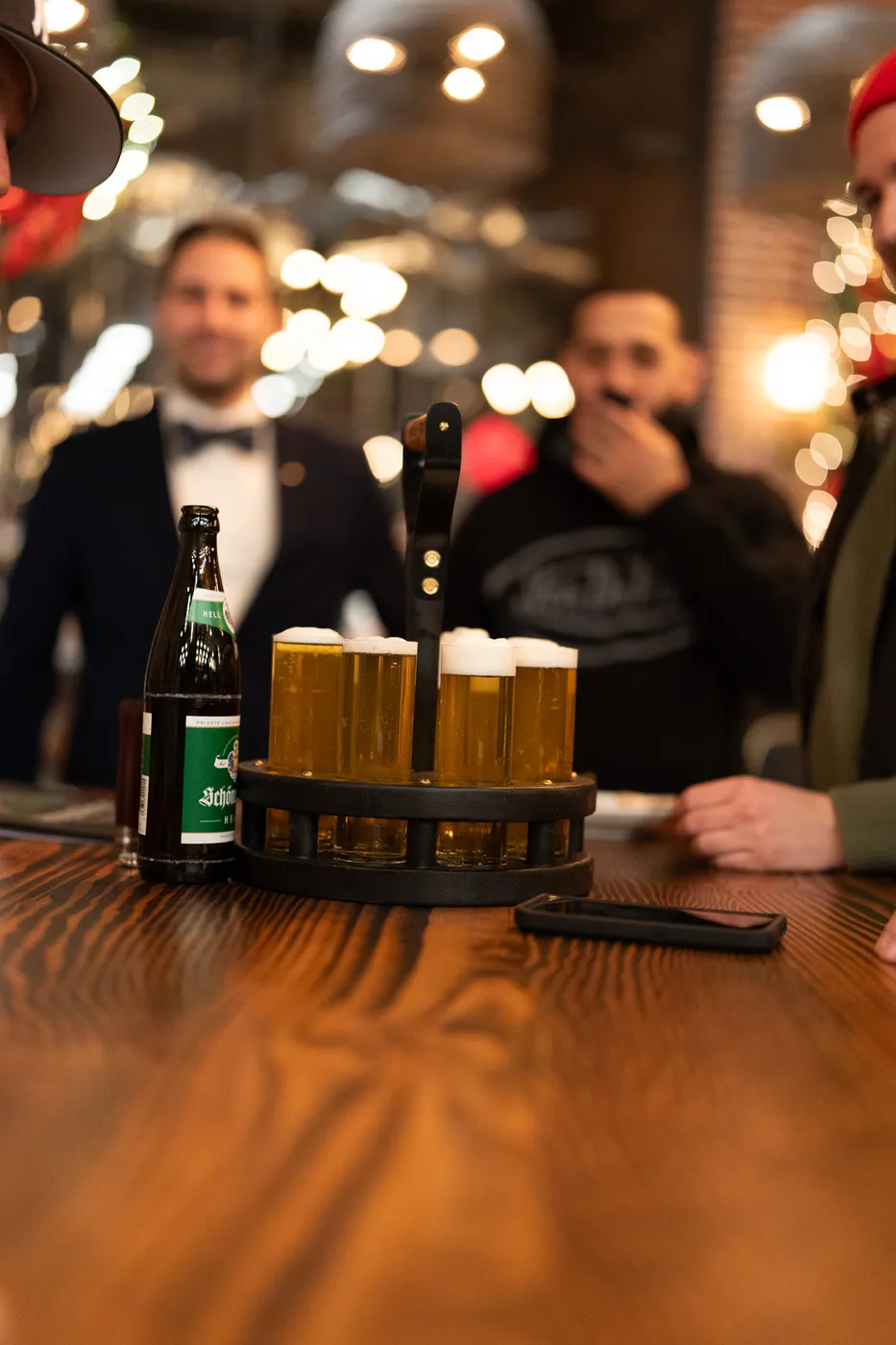 Friends sharing a flight of lagers at the Kills Boro bar