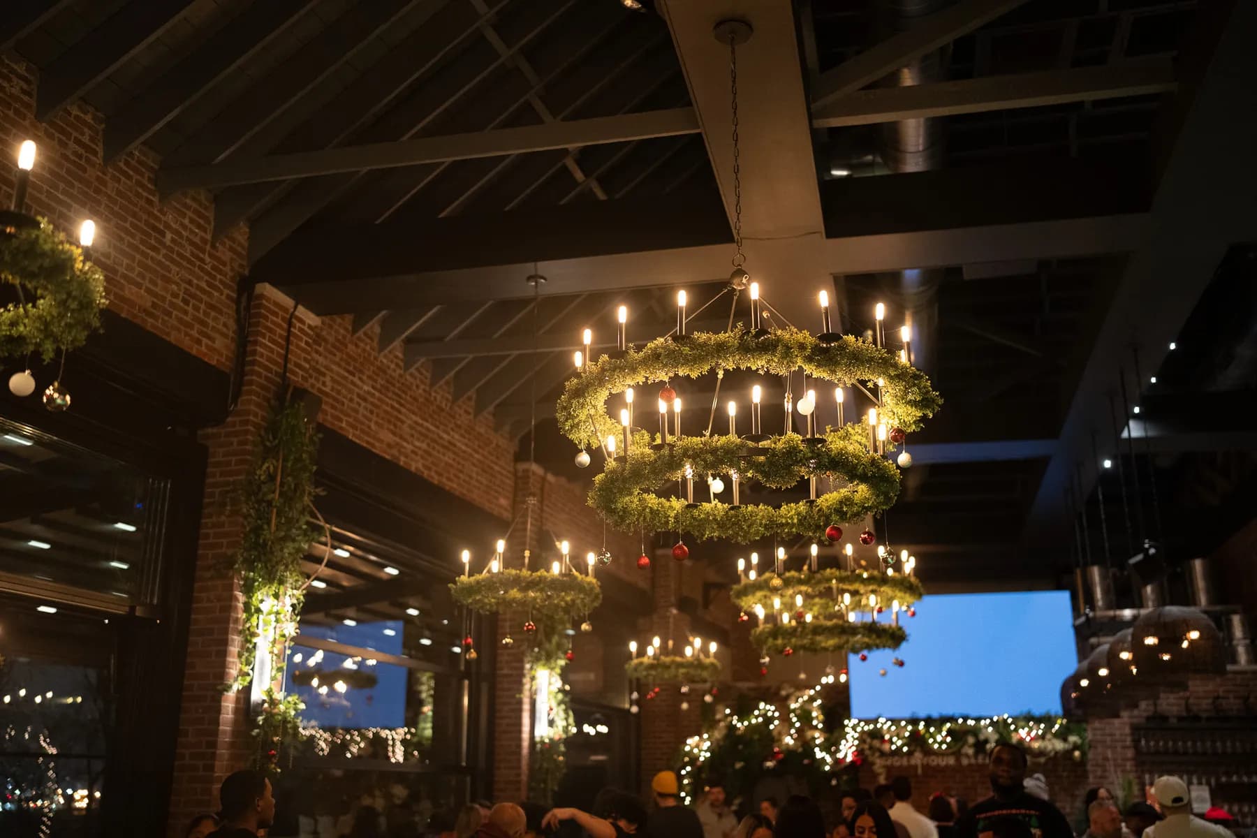 A full house under the wreath chandeliers at a Kills Boro holiday party